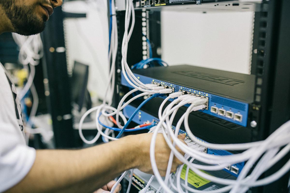 network technician working on a switch